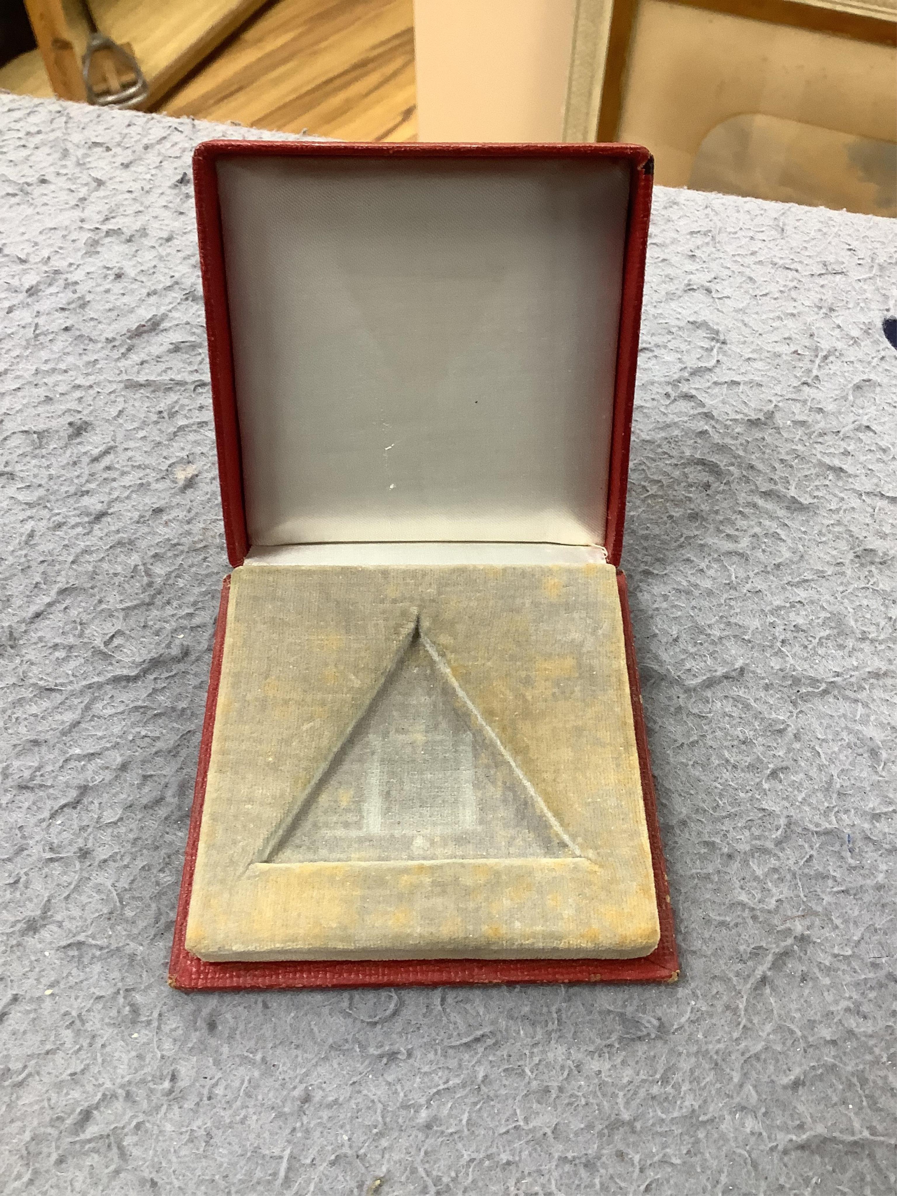 A cased gold plated Minimax Masonic triangular pocket watch, with symbol 'numerals', 48mm by 55mm. Condition - poor to fair